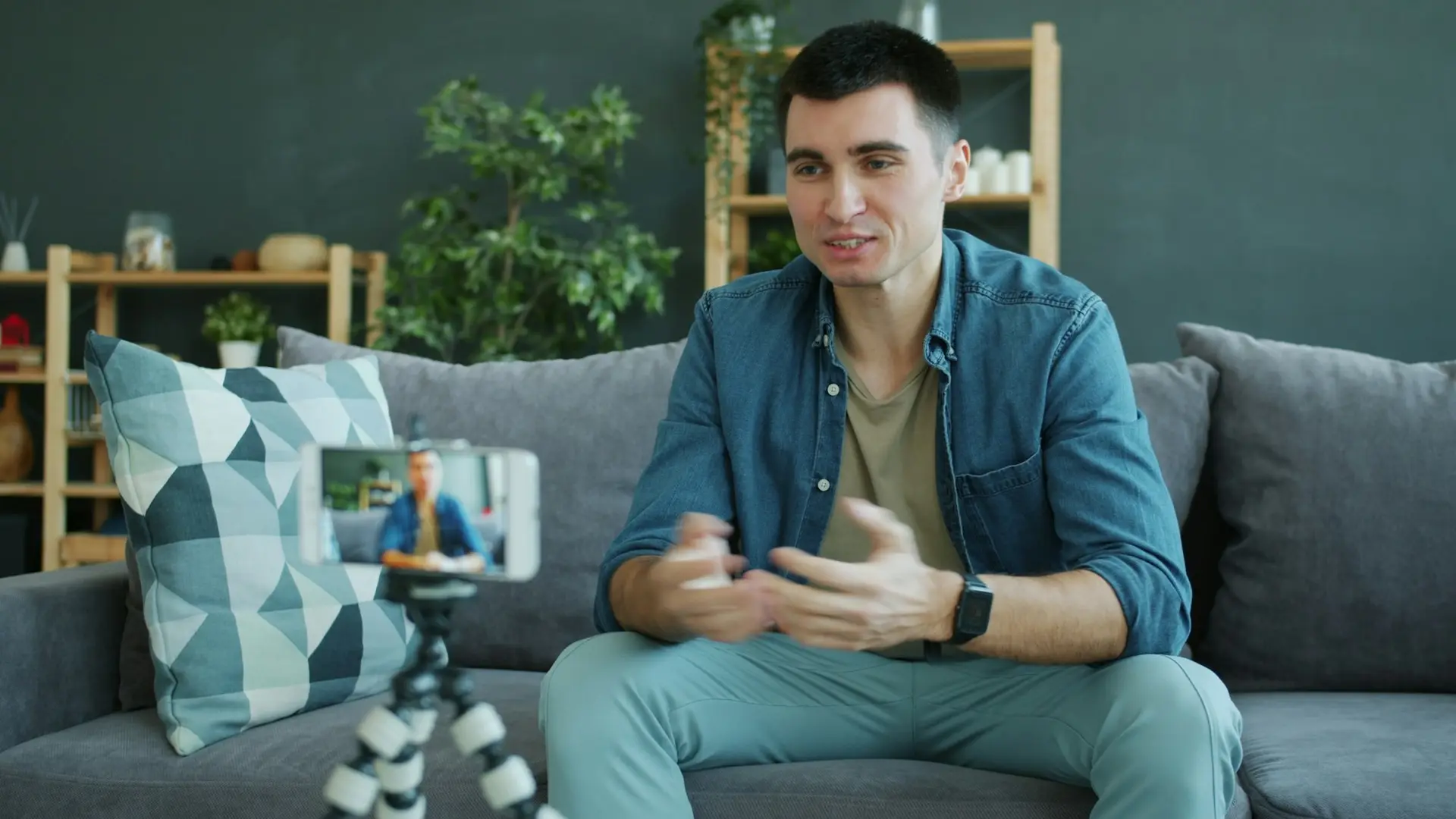 Man talking to a smartphone on a tripod