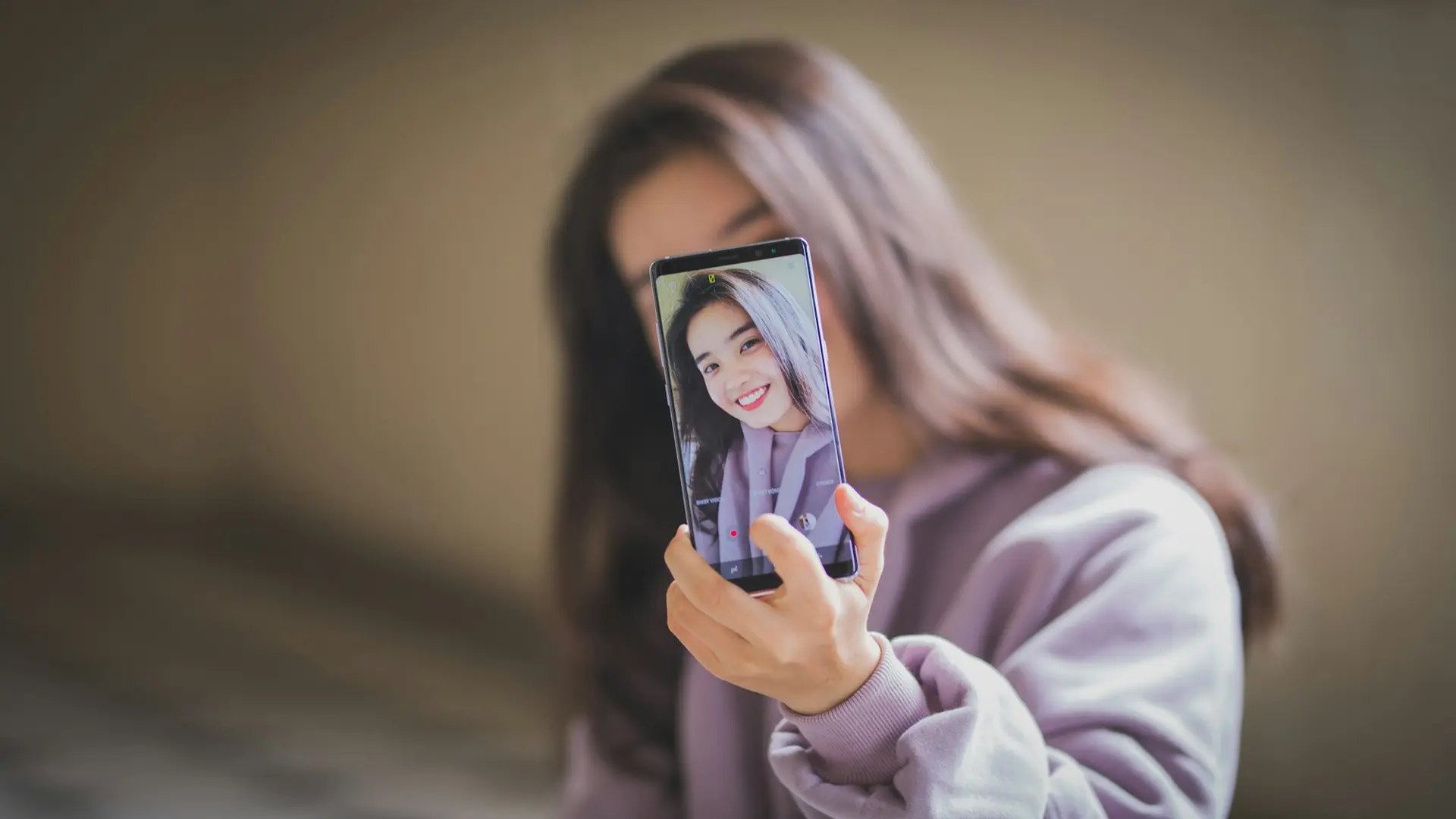 Woman holding a smartphone