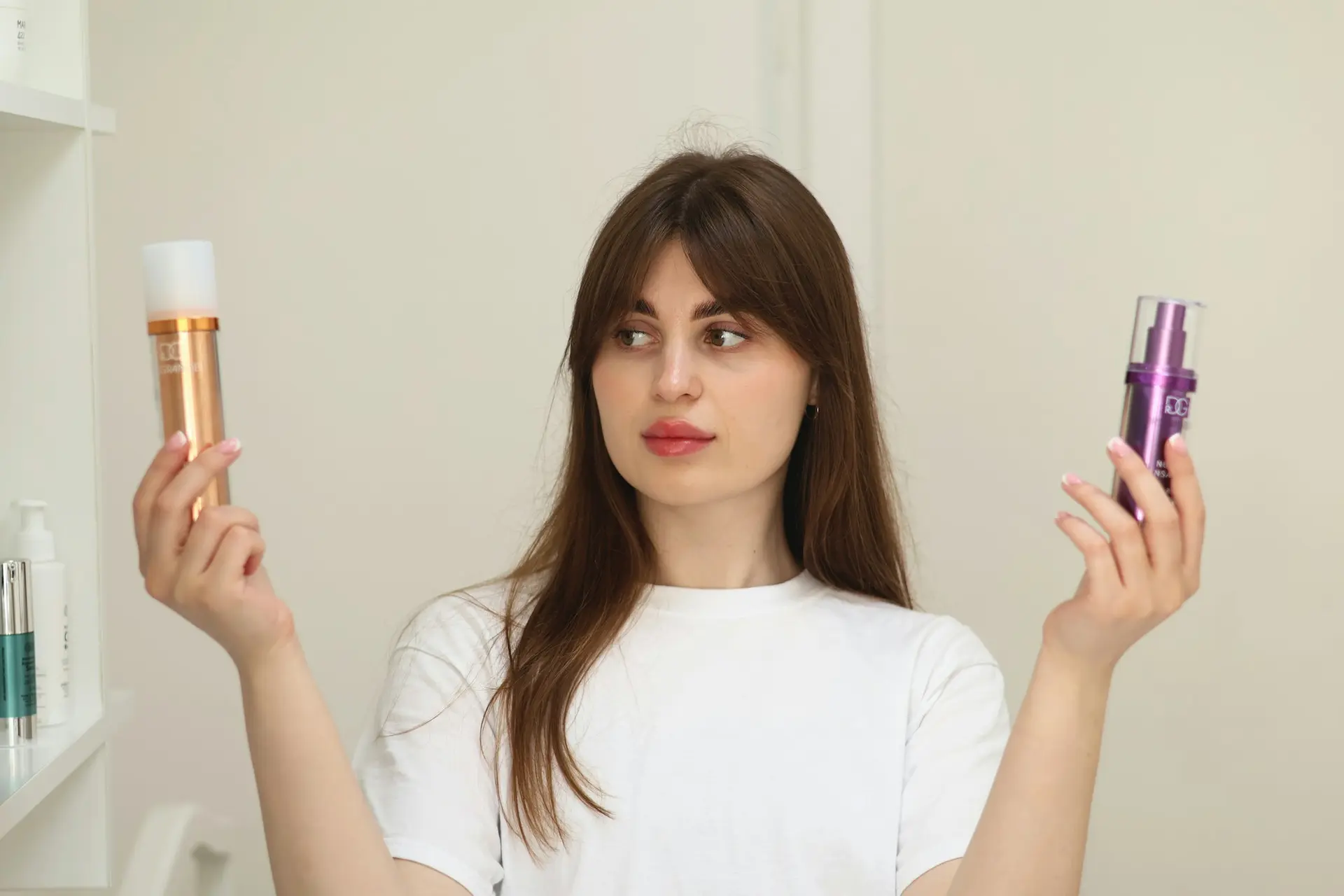 Woman holding two skincare products